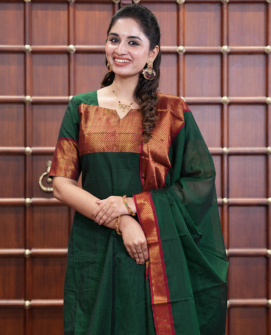 Bottle Green Mercerised Cotton Material Churidar Set, Subtly Made with Plain and Traditional Ara Maadam Bordered Top, Comes with a Plain Mercerised Cotton Bottom, and Is Paired with a Mercerised Cotton Ara Maadam Woven Dupatta
