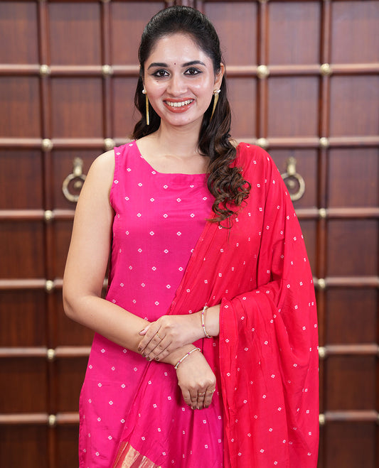Pink and Red Semi-Silk Material Churidar Set, Prettified with Bandhani Dots Print, Comes with a Plain Santoon Bottom, and Paired with a Double-Colored Dupatta of Bandhani Dots Print