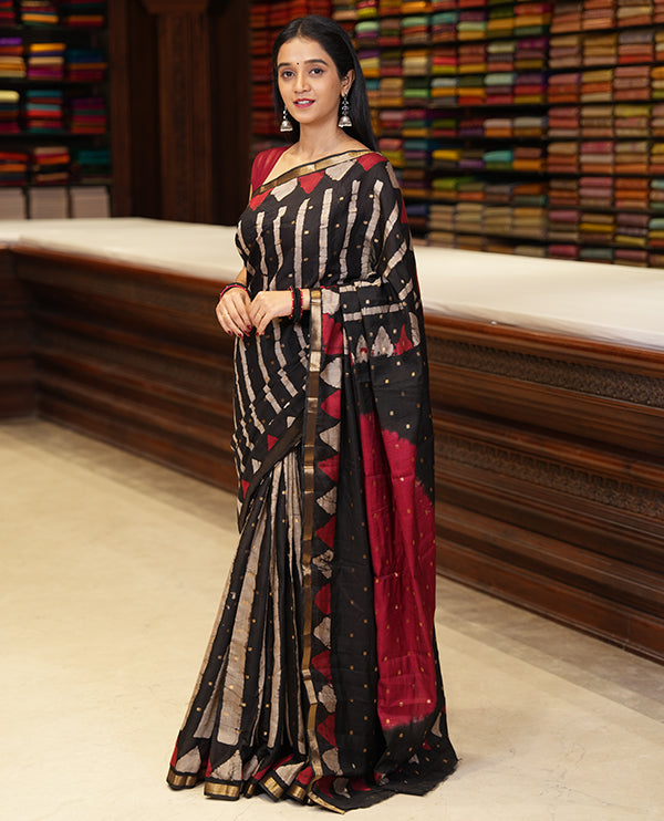 Black batik printed with zari buttas woven chanderi cotton saree, piping zari border, big circle printed pallu, and contrast zari buttas blouse