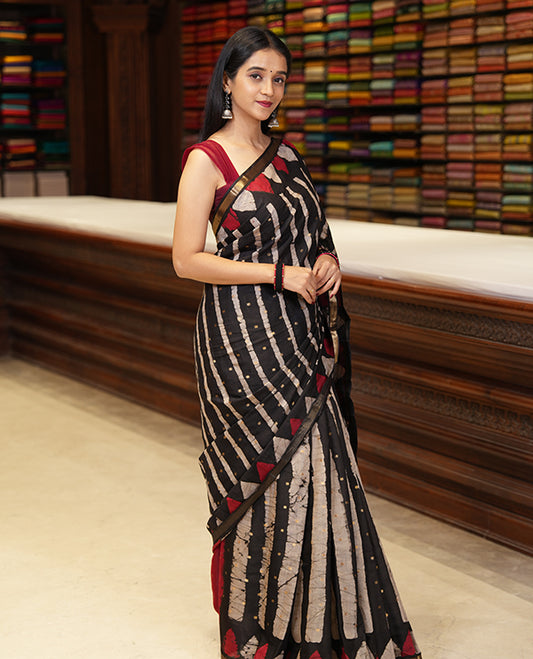 Black batik printed with zari buttas woven chanderi cotton saree, piping zari border, big circle printed pallu, and contrast zari buttas blouse