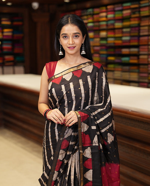 Black batik printed with zari buttas woven chanderi cotton saree, piping zari border, big circle printed pallu, and contrast zari buttas blouse