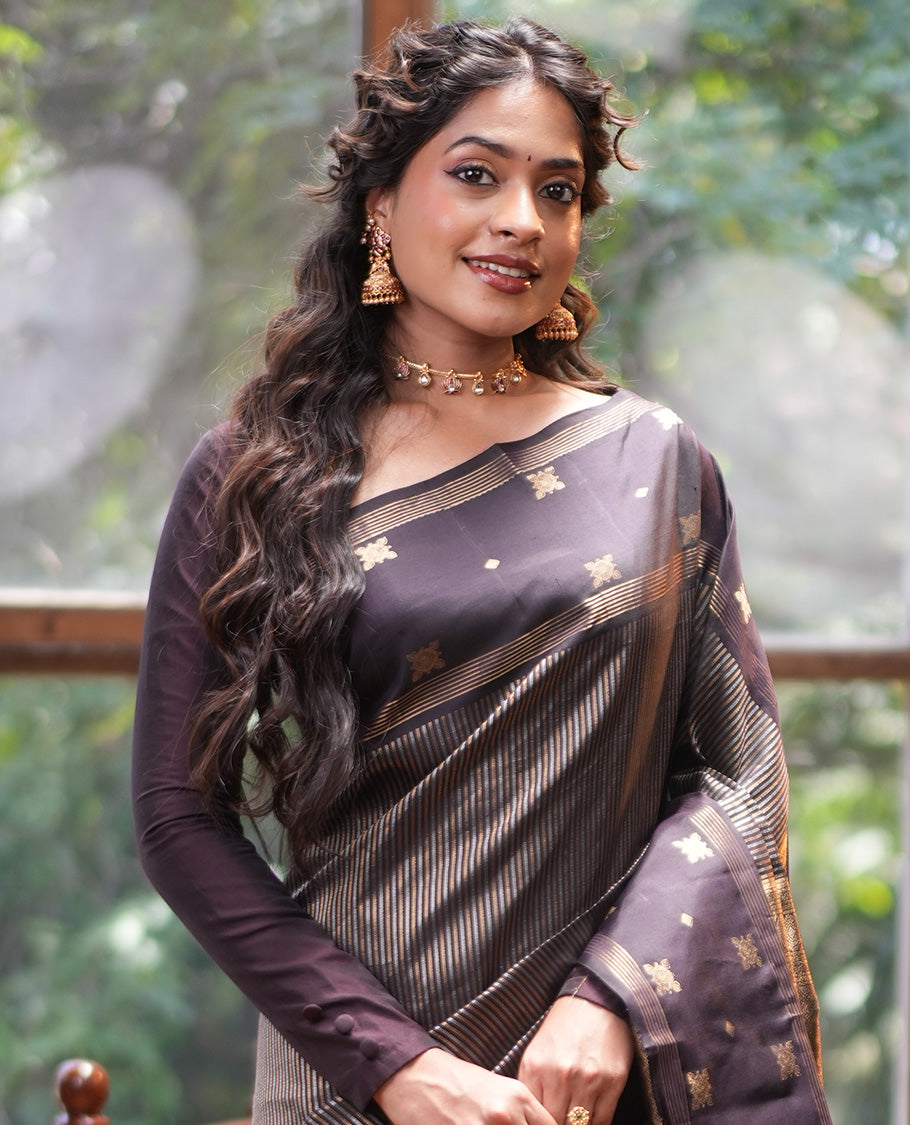 Dark Brown Vasundhara Silk Saree, Elevated with Thick Vaira Oosi-style Stripes On Its Body, Highlighted by Zari Unique Design Border, Grand Jaal Pallu, and Paired with a Matching Blouse