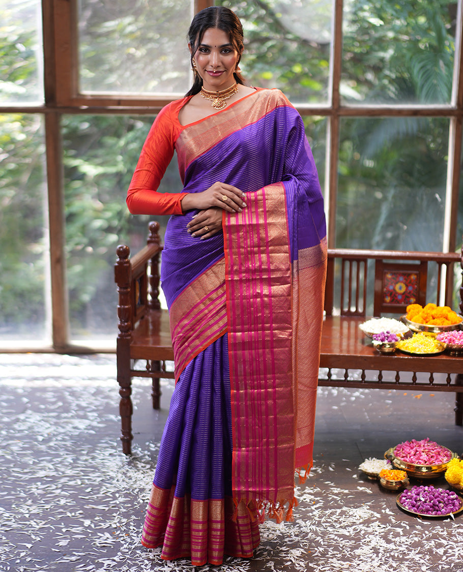 Violet and Pink Vasundhara Silk Saree, Enriched with Zari Stripes All Over Its Body, Complemented by Contrast Border of Thilakam Mokku, Muthu, Mayil, Neli, and Cross Kamalam Designs, Jaal Pallu, and Paired with a Veldhari With Bordered Blouse