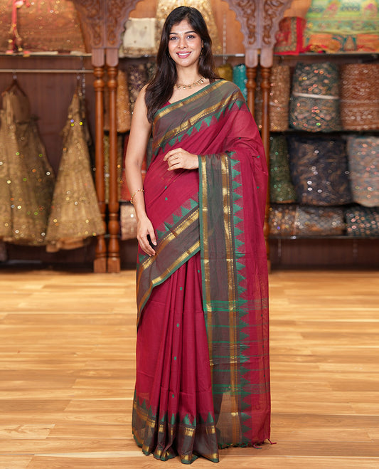 Maroon Chettinad Cotton Saree, Subtly Sparkled with Thread Buttas All Over Its Body, Complemented by a Contrast Border Rettai Pettu Border of Paisley and Chevron Stripes, Subtly Designed Pallu, and Paired with a Matching Blouse