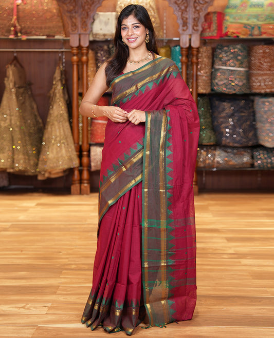Maroon Chettinad Cotton Saree, Subtly Sparkled with Thread Buttas All Over Its Body, Complemented by a Contrast Border Rettai Pettu Border of Paisley and Chevron Stripes, Subtly Designed Pallu, and Paired with a Matching Blouse