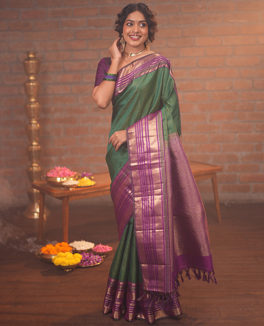 Green and Magenta Vasundhara Silk Saree, Enriched with Veldhari and Muthu Stripes On Its Body, Complemented by Contrast Border of Muthu, Lavangam, Neli, Mayil Kann, And Mayil Designs, Grand Pallu, and Paired with a Contrast Blouse