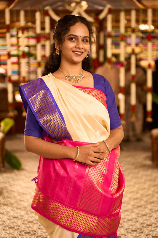 Light cream plain nine-yard silk saree, contrast pink-blue Ganga Jamuna korvai border & pallu of traditional ara maadam designs
