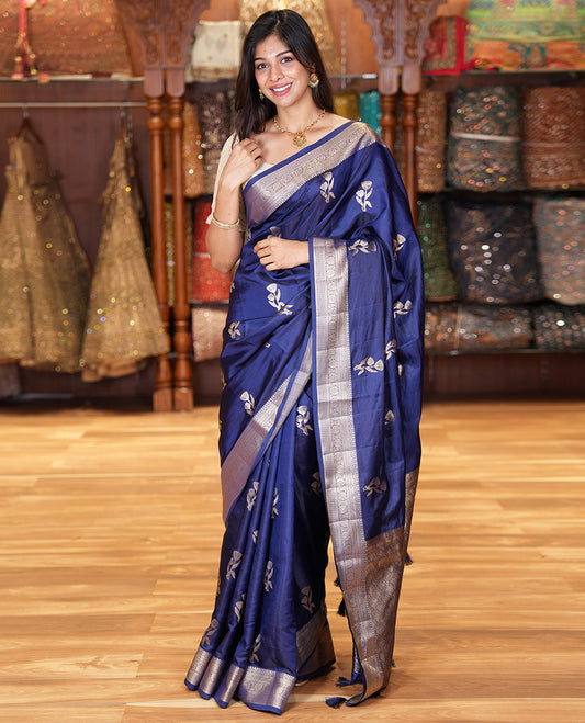Navy Blue Semi-Banaras Satin Silk Saree, Dazzled with Floral Zari Buttas Across Its Body, Highlighted by Traditional Zari Design Border, Grand Zari Woven Palu of Jaal Designs, and Paired with a Matching Blouse