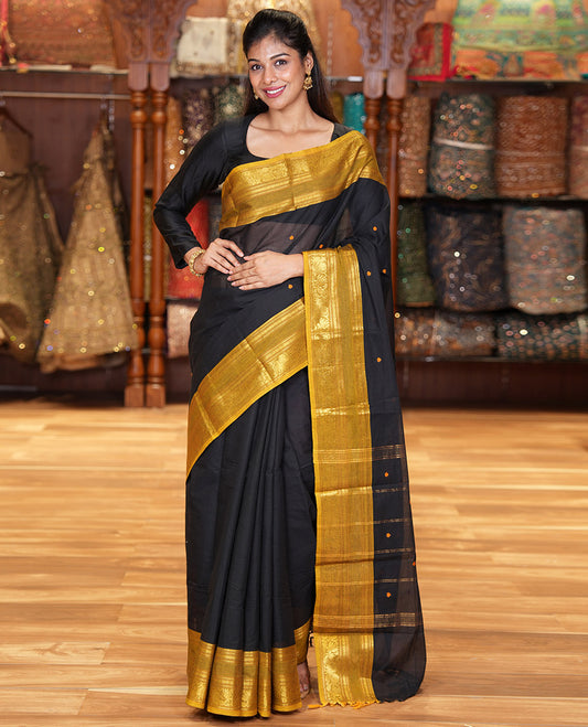 Black Chettinad Cotton Saree, Adorned with Buttas All Over Its Body, Complemented by a Contrast Traditional Zari Rettai Pettu Border, Pallu of Stripes and Buttas, and Paired with a Matching Blouse