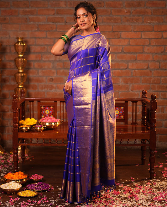 M.s Blue Vasundhara Silk Saree, Adorned with Round Mayil Butta Enclosed Checks, a Zari Border of Mayil Kann and Kodi Visiry, Jaal Pallu, and Paired with a Matching Blouse