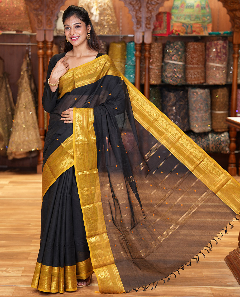 Black Chettinad Cotton Saree, Adorned with Buttas All Over Its Body, Complemented by a Contrast Traditional Zari Rettai Pettu Border, Pallu of Stripes and Buttas, and Paired with a Matching Blouse