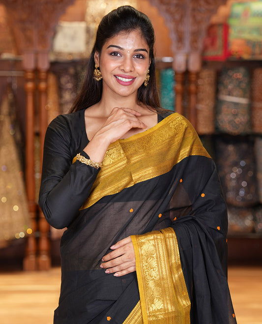 Black Chettinad Cotton Saree, Adorned with Buttas All Over Its Body, Complemented by a Contrast Traditional Zari Rettai Pettu Border, Pallu of Stripes and Buttas, and Paired with a Matching Blouse