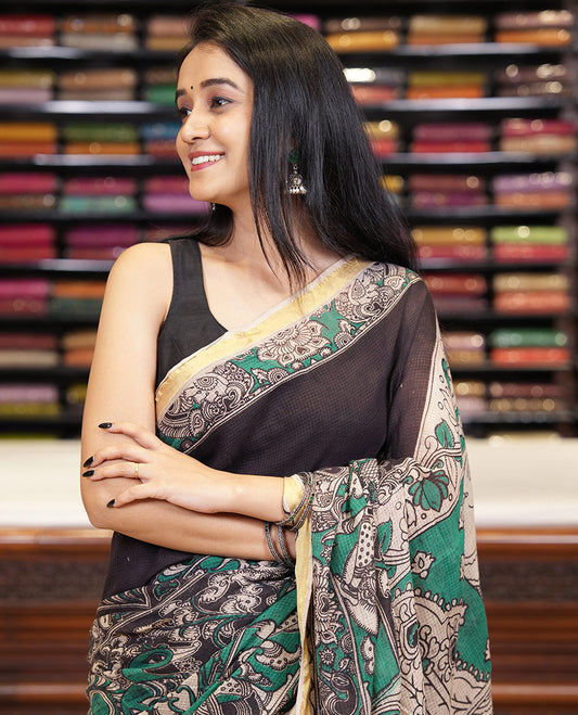Green kalamkari floral, peacock, and human figurines printed Kota cotton saree, contrast printed border, peacock printed pallu, and a contrast floral printed blouse