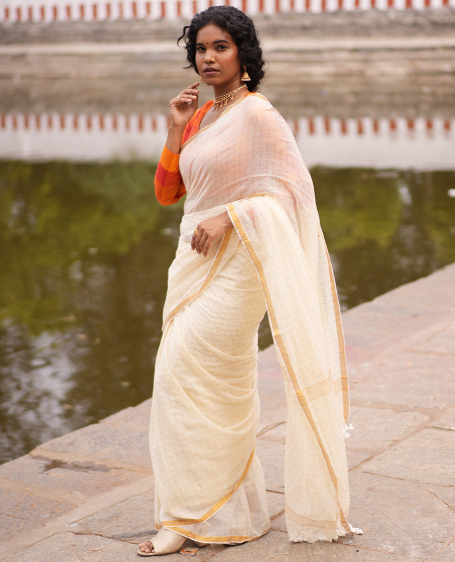 Cream Khadi Mul Cotton Saree, Subtly Sparkled With Zari Checks, a Zari Piping Border and No Blouse