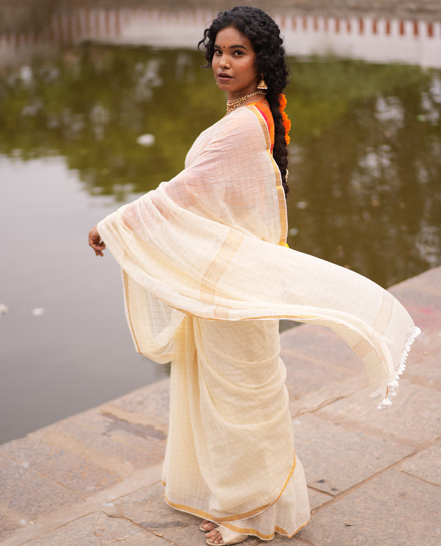 Cream Khadi Mul Cotton Saree, Subtly Sparkled With Zari Checks, a Zari Piping Border and No Blouse