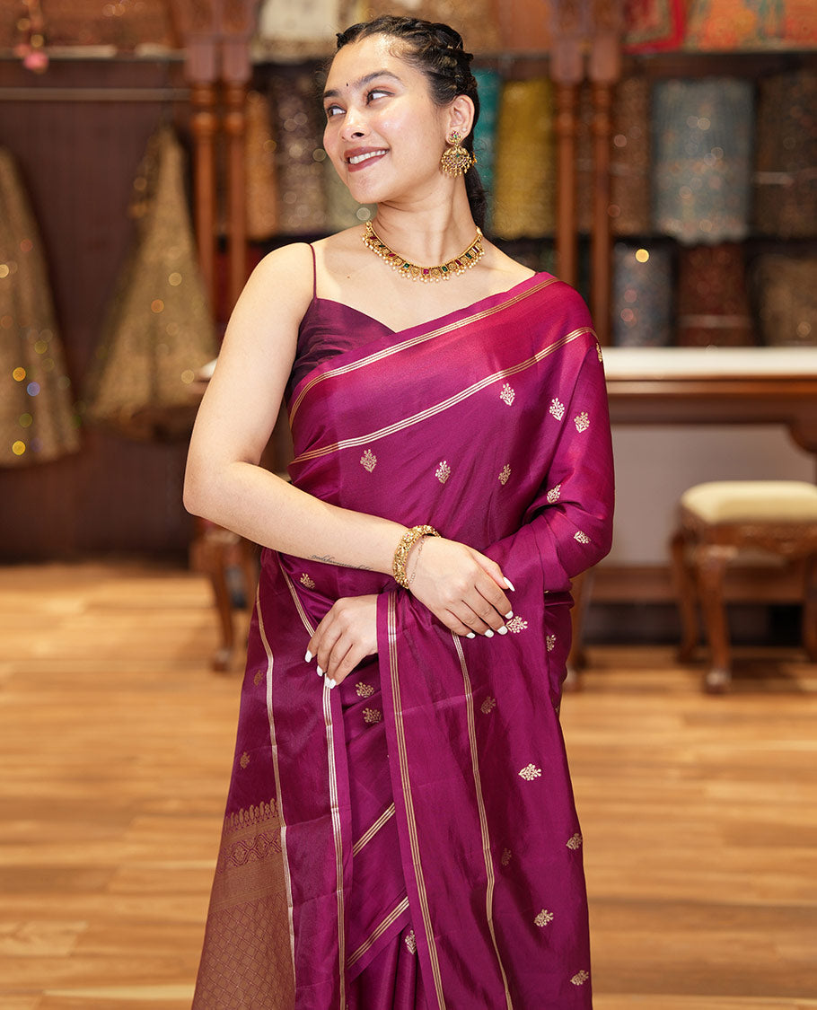 Magenta Pink Semi-Banaras Satin Silk Saree, Ornamented with Zari Buttas All Over Its Body, Highlighted by Zari Striped Border, Grand Jaal Pallu, and Paired with a Matching Blouse