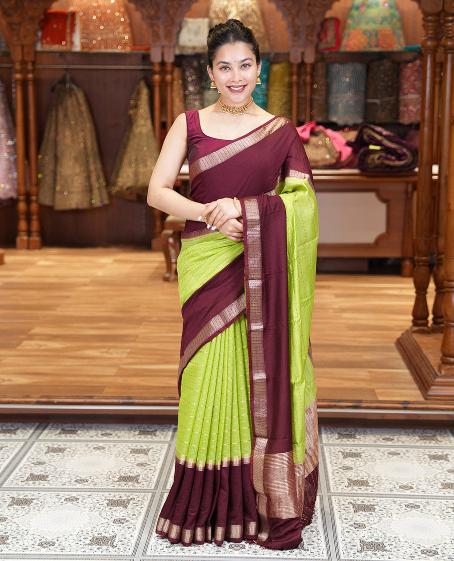 Elaichi Green Assam Silk Saree, Embellished with Horizontal Zari Stripes All Over Its Body, Complemented by a Contrast Traditional Zari Design Rettai Pettu Border, Grand Zari Striped Pallu, and Paired with a Contrast Blouse