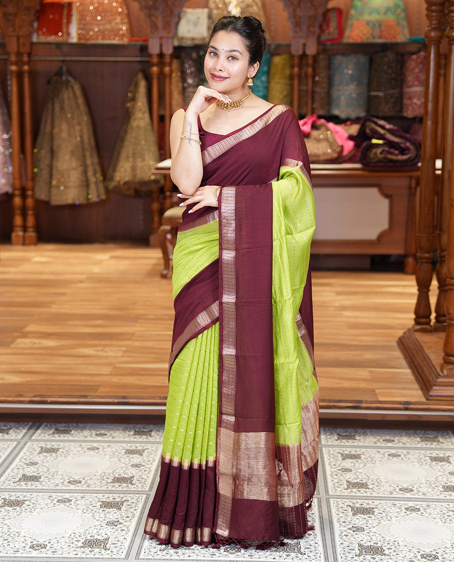 Elaichi Green Assam Silk Saree, Embellished with Horizontal Zari Stripes All Over Its Body, Complemented by a Contrast Traditional Zari Design Rettai Pettu Border, Grand Zari Striped Pallu, and Paired with a Contrast Blouse