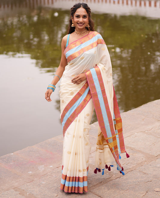 Cream Kerala Cotton Saree, Bedecked with Zari Buttas, Contrast Peacock-Paisley Border, a Matching Blouse