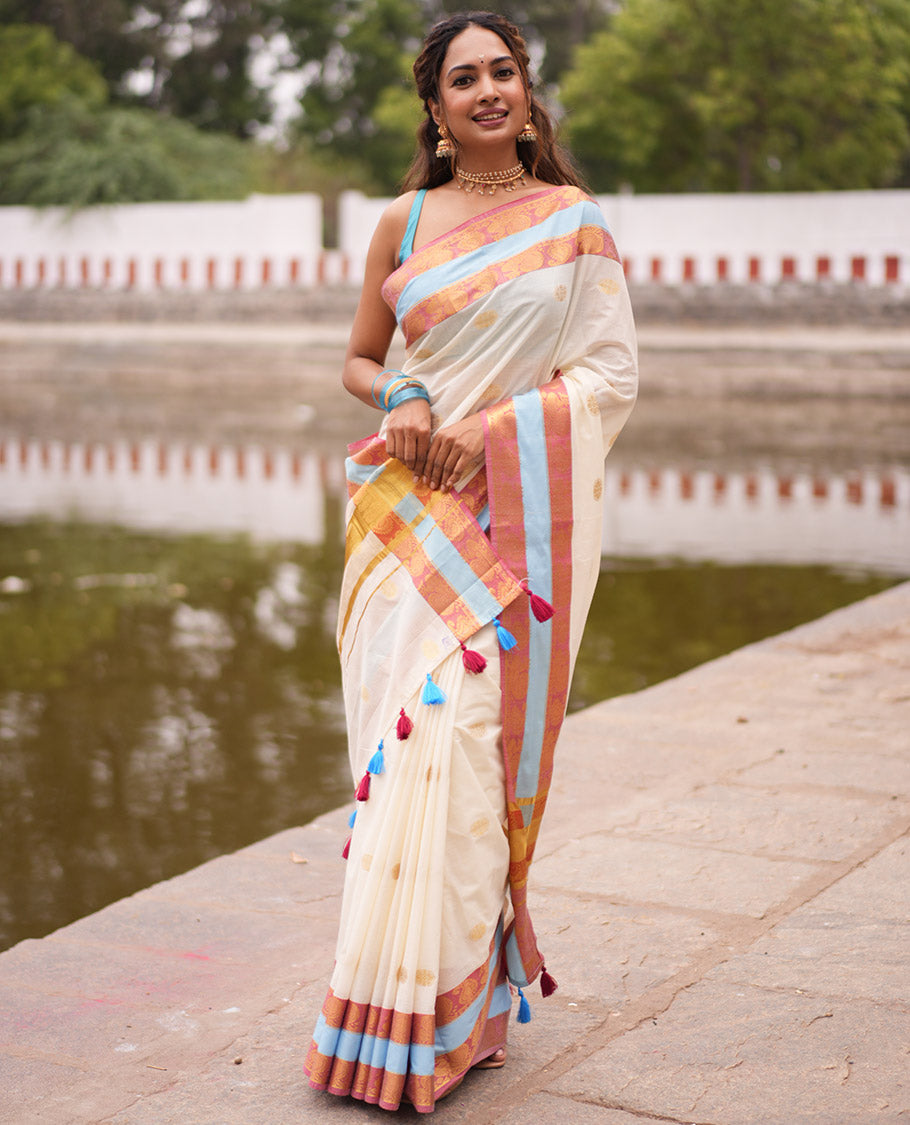 Cream Kerala Cotton Saree, Bedecked with Zari Buttas, Contrast Peacock-Paisley Border, a Matching Blouse