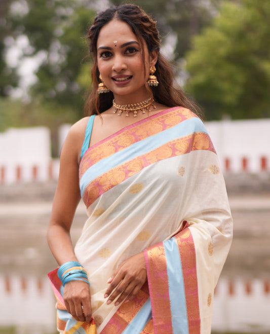 Cream Kerala Cotton Saree, Bedecked with Zari Buttas, Contrast Peacock-Paisley Border, a Matching Blouse