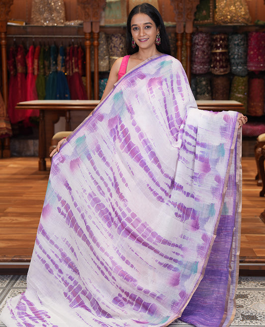 White-Violet Linen Cotton Saree, Decked Up with Shibori Print, a Piping Border, Shibori-Printed Pallu, and a Contrast Blouse