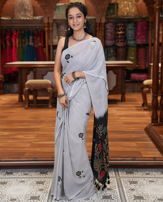 Borderless Grey-Black Georgette Saree, Adorned with Floral Motifs, Contrast Floral Printed Mirrorwork Pallu, and a Contrast Designer Blouse