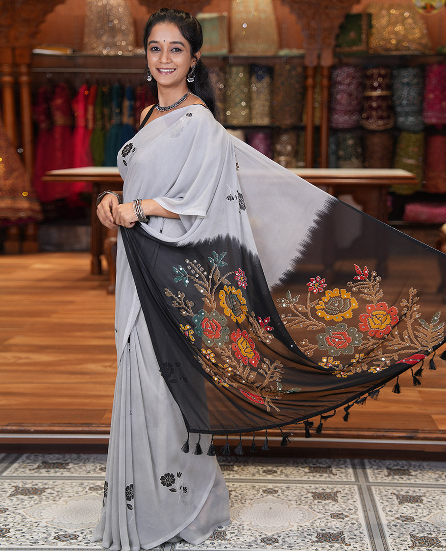 Borderless Grey-Black Georgette Saree, Adorned with Floral Motifs, Contrast Floral Printed Mirrorwork Pallu, and a Contrast Designer Blouse