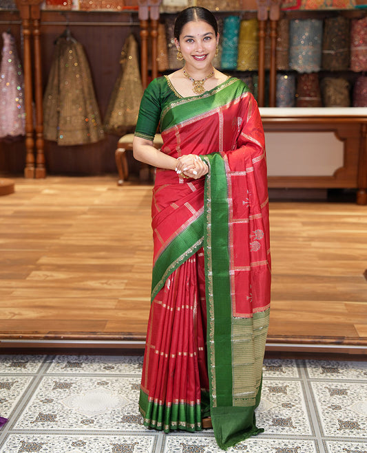 Red Mango-Silk Saree, Artfully Detailed with Meena Butta Enclosed Checks All Over Its Body, Complemented by a Contrast Floral Creeper Meenakari Border, Gleaming Zari Striped Pallu, and Paired with a Contrast Blouse