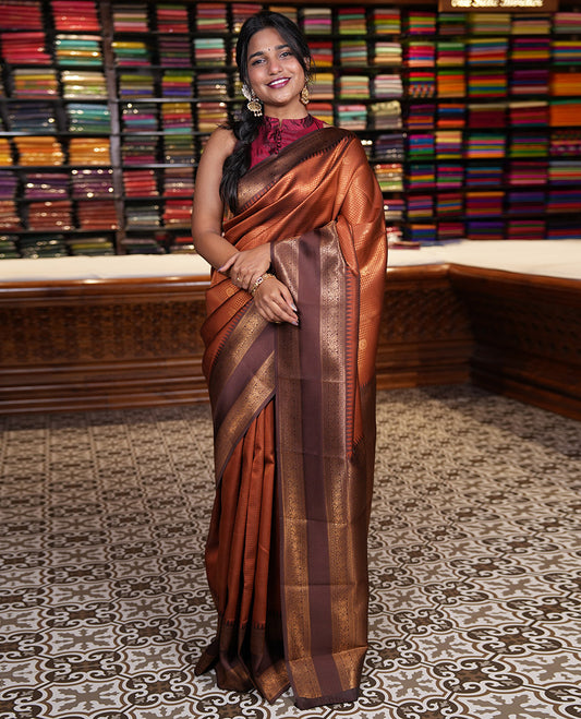 Rust orange-brown checked and peacock chakra zari buttas kanchi silk saree, contrast traditional zari rettai pettu border, jaal pallu, and a jacquard blouse