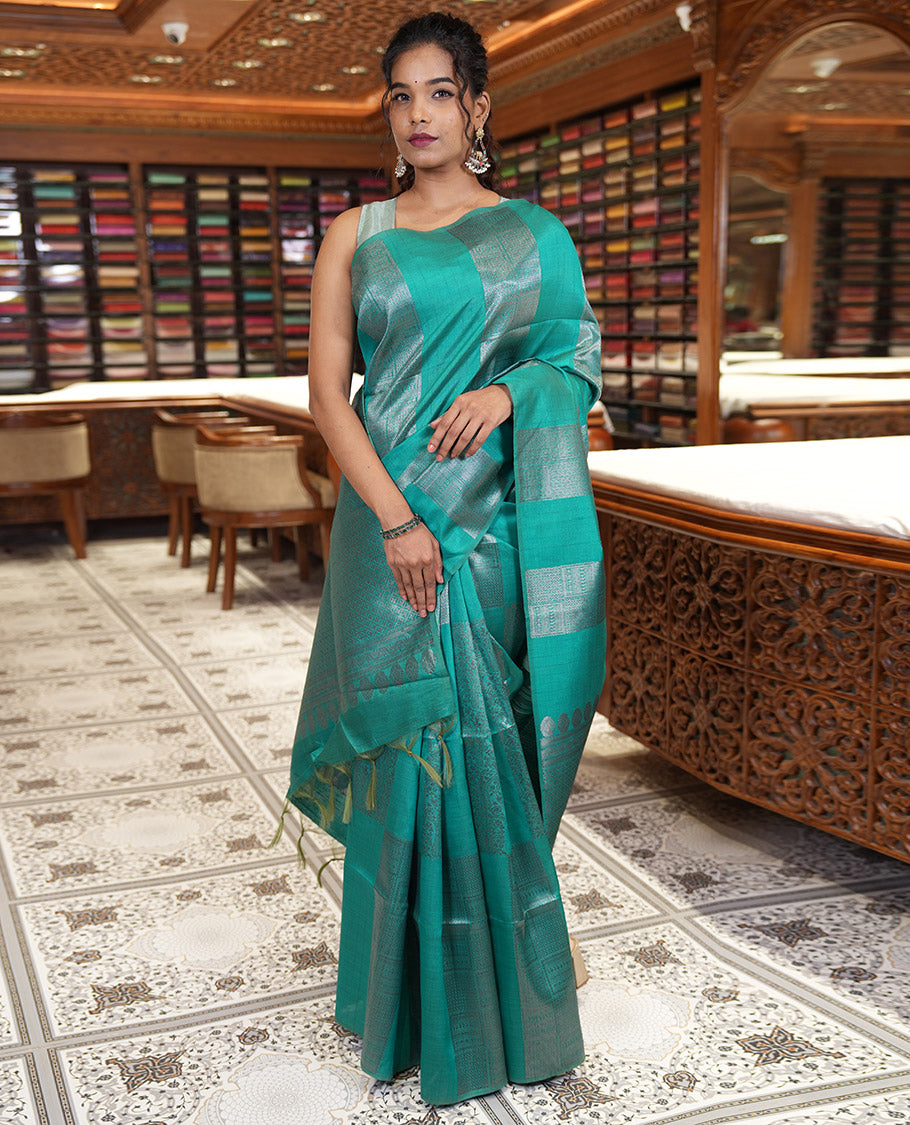 Borderless, blue striped, and zari traditional kanchi motifs fancy tussar saree, intricately zari-woven pallu, and a matching zari buttas woven blouse