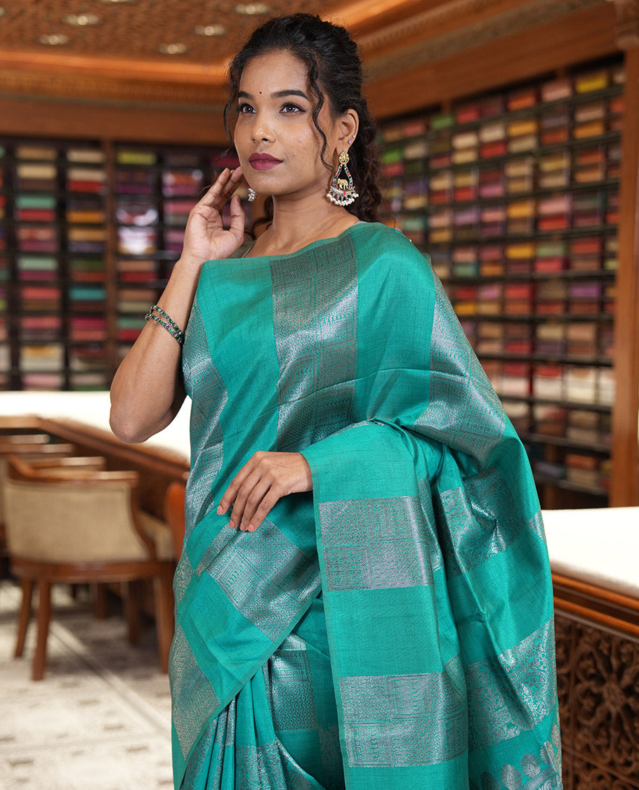 Borderless, blue striped, and zari traditional kanchi motifs fancy tussar saree, intricately zari-woven pallu, and a matching zari buttas woven blouse