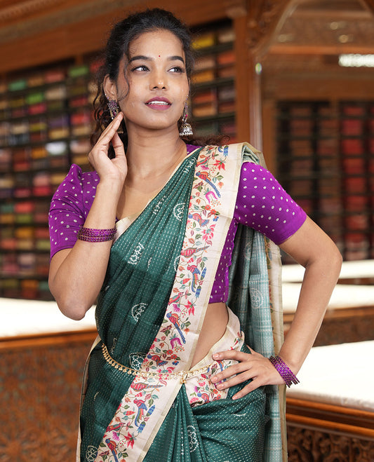 Green zari buttas and bandhani dotted fancy tussar saree, contrast floral and bird printed border, striped pallu, and a matching blouse