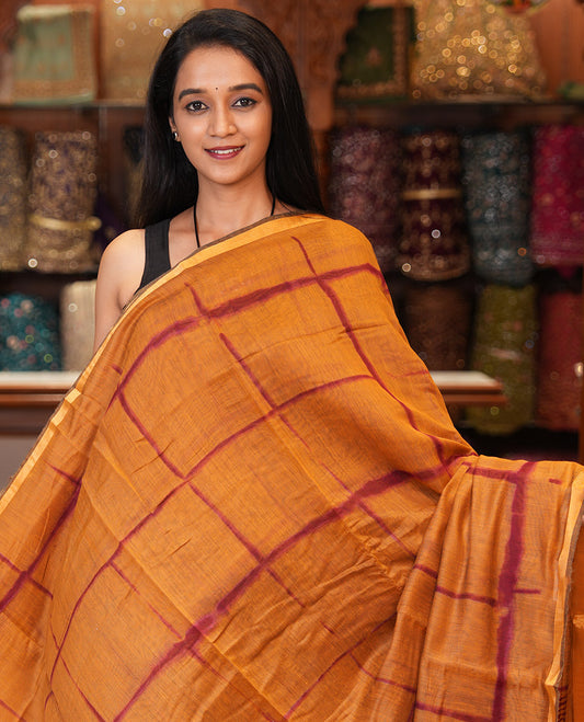 Mustard Linen Cotton Saree, Adorned with Shibori Checks, a Subtle Piping Border, Geometric Pallu, and a Matching Blouse