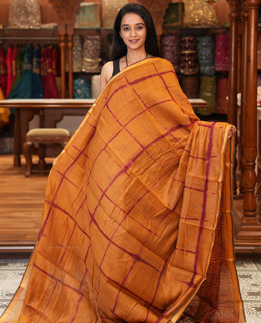 Mustard Linen Cotton Saree, Adorned with Shibori Checks, a Subtle Piping Border, Geometric Pallu, and a Matching Blouse