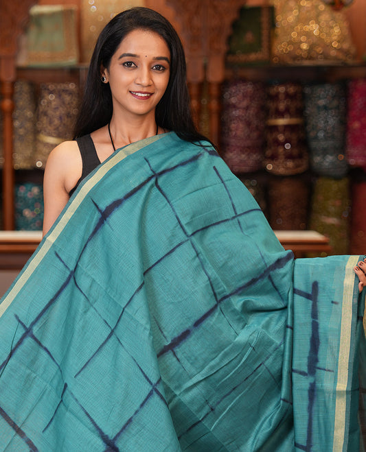 Rama Linen Cotton Saree, Adorned with Shibori Checks, a Subtle Piping Border, Geometric Pallu, and a Matching Blouse