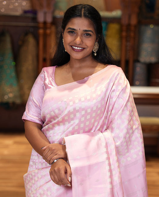Pink Kanchi Silk Saree, Embellished with Checked Design on Its Body, Highlighted by a Self-Border of Diamond Patterns, Pallu Steeped with Buttas, and Paired with a Matching Blouse