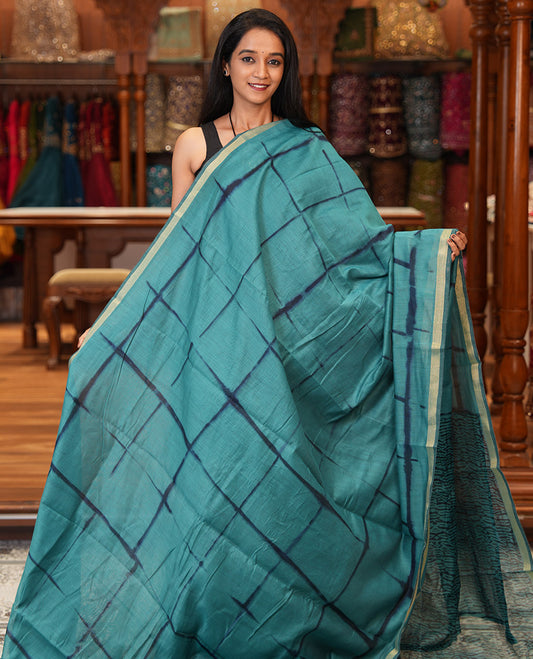 Rama Linen Cotton Saree, Adorned with Shibori Checks, a Subtle Piping Border, Geometric Pallu, and a Matching Blouse