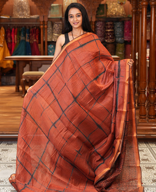 Rust Linen Cotton Saree, Adorned with Shibori Checks, a Subtle Piping Border, Geometric Pallu, and a Matching Blouse