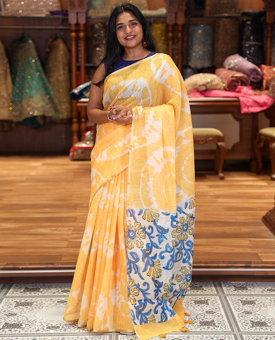 Borderless Yellow Linen Cotton Saree, Decked Up with Shibori Printed on Its Body, Complemented by Contrast Floral Printed Pallu, and Paired with a Contrast Floral Printed Blouse
