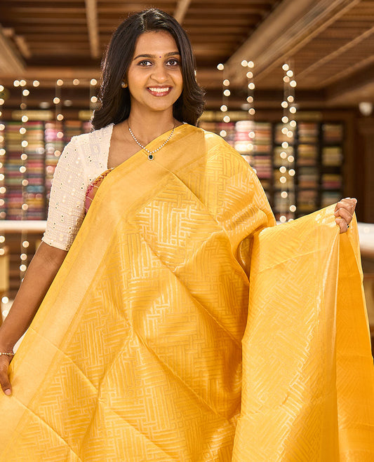 Yellow-color base rose-gold jacquard Kanchipuram silk saree, zari border & diamond buttas woven pallu