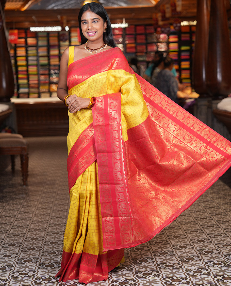 Yellow Litchi Saree, Detailed with Paisley Butta Enclosed Checks, Complemented by a Contrast Rettai Pettu Peacock-Elephant Border, a Contrast Blouse