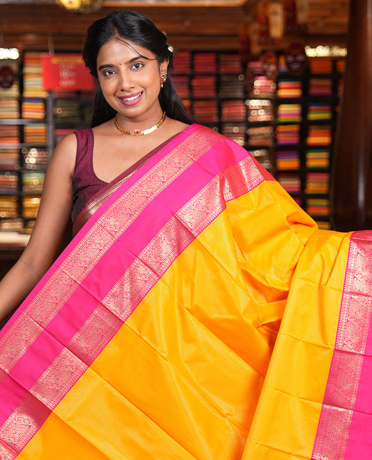 Yellow-Pink Budget Silk Saree, Accentuated with Zari Stripes, Contrast Rettai Pettu Peacock Border, Grand Pallu, and a Contrast Blouse
