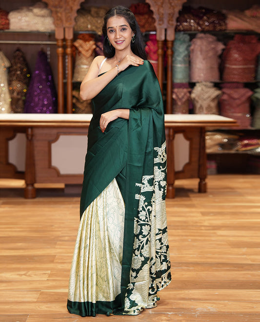 Chikku-green half-and-half plain and kalamkari floral printed satin crepe saree, plain border, pallu of floral vine and peacock printed, and kalamkari floral printed blouse