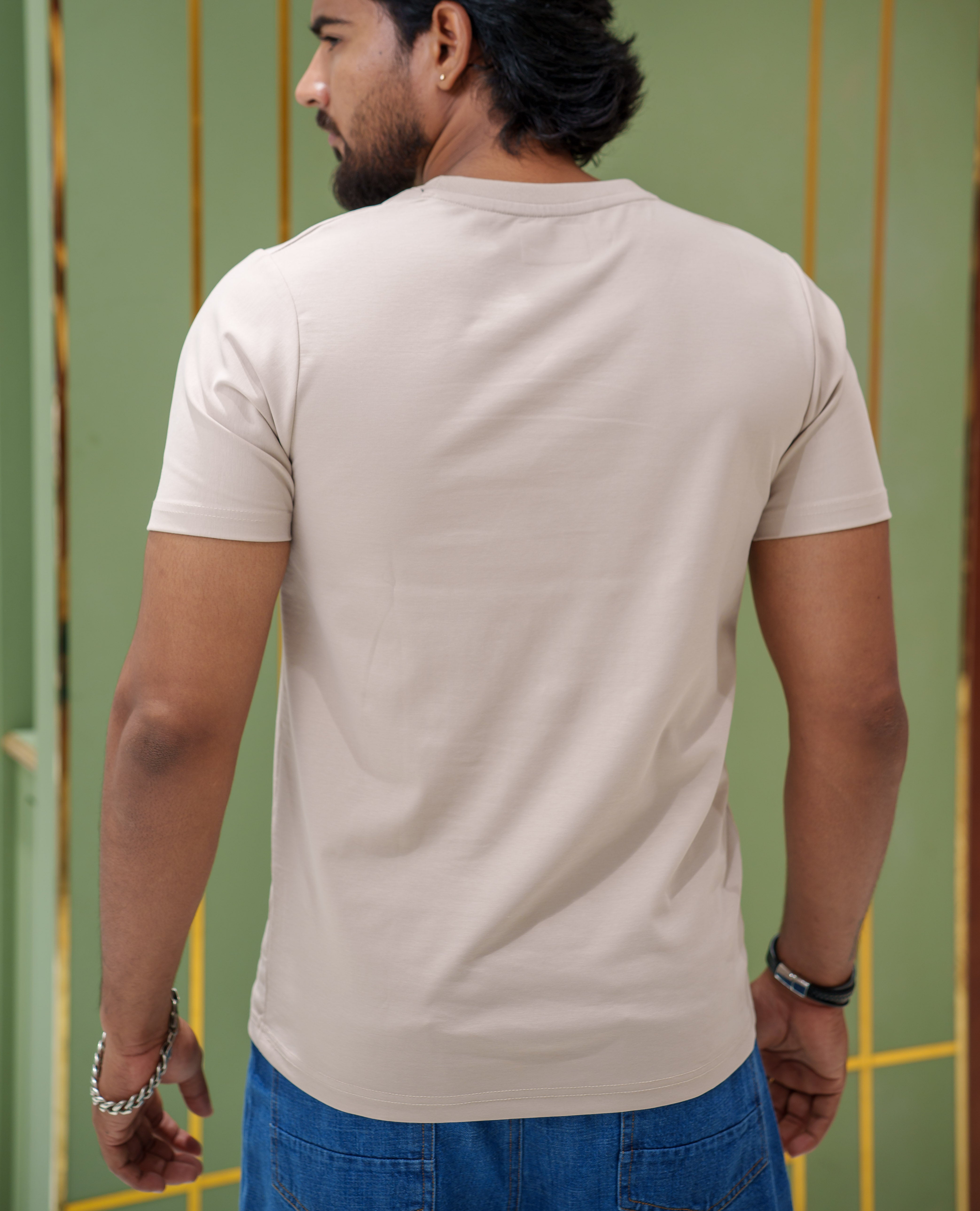 Cream Cotton-Blended T-Shirt, Comes with a Unique Motif Print, a Crew Neck, Half Sleeves, Slim Fit, and Regular Length