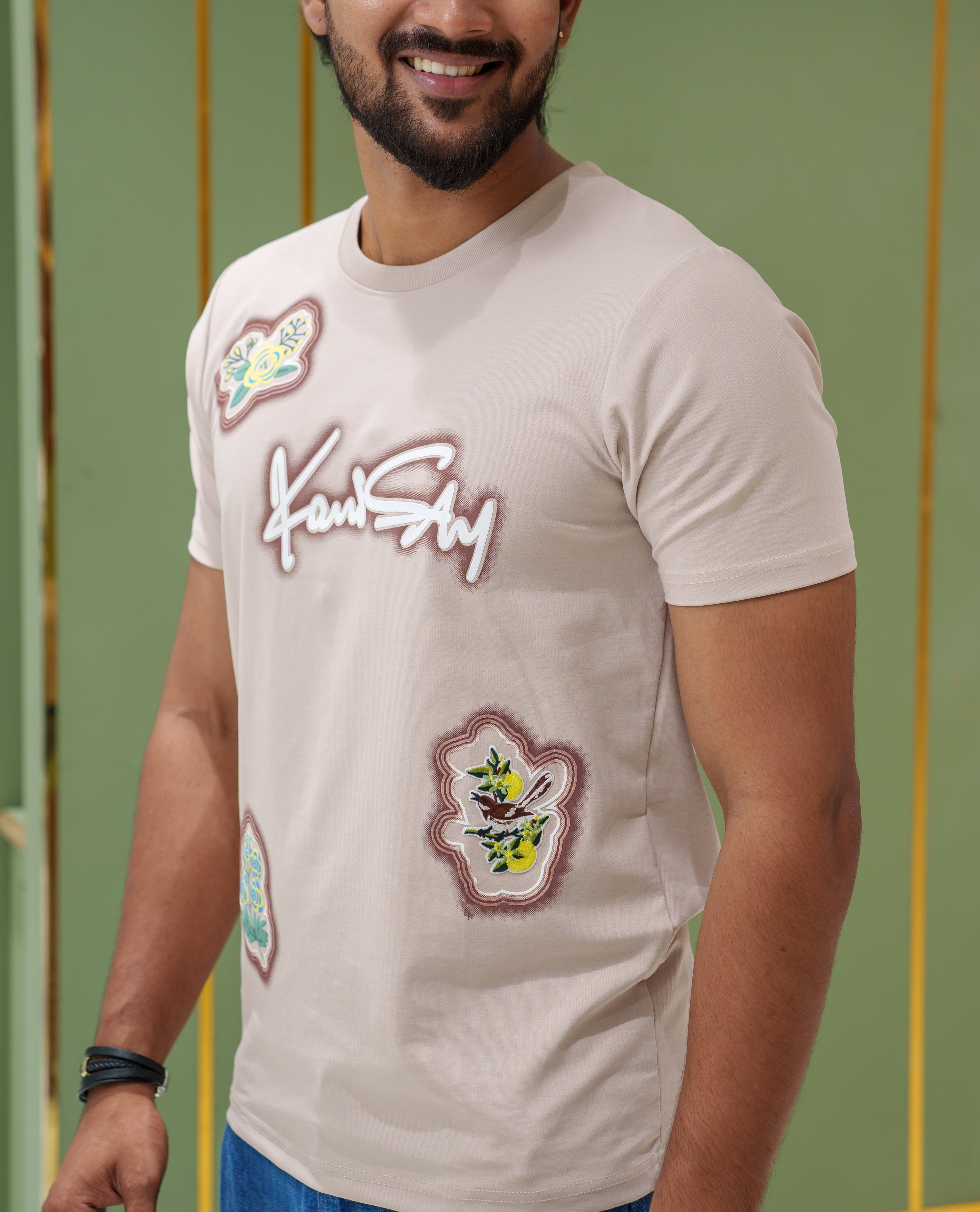 Cream Cotton-Blended T-Shirt, Comes with a Unique Motif Print, a Crew Neck, Half Sleeves, Slim Fit, and Regular Length
