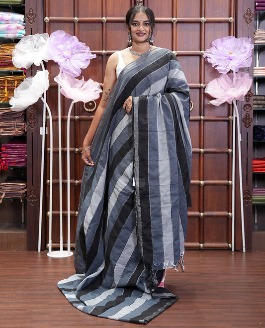 Grey Khadi Mul Cotton Saree, Beautified with Vertical Stripes All Over Its Body, Subtle Piping Border, a Self-Pallu, and Paired with a Matching Blouse