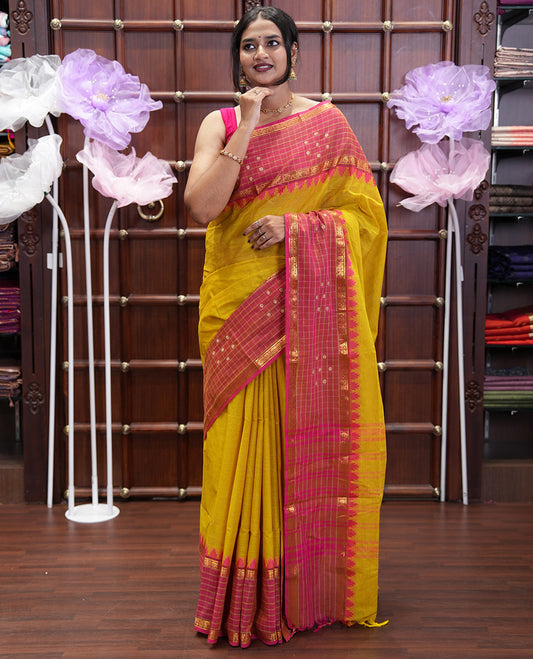 Yellow Plain Chettinad Cotton Saree, Complemented by Contrast Traditional Temple Border of Butta Enclosed Checks, Subtly Striped Pallu, and Paired with a Matching Blouse