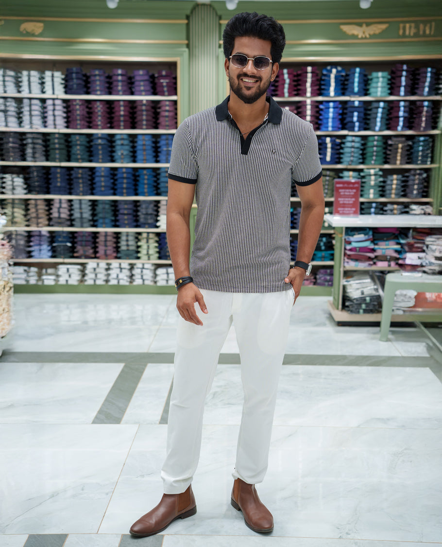 Black Striped Cotton-Blended T-Shirt Comes with Half-Sleeves, a Polo Collar, a Slim Fit, and Regular Length