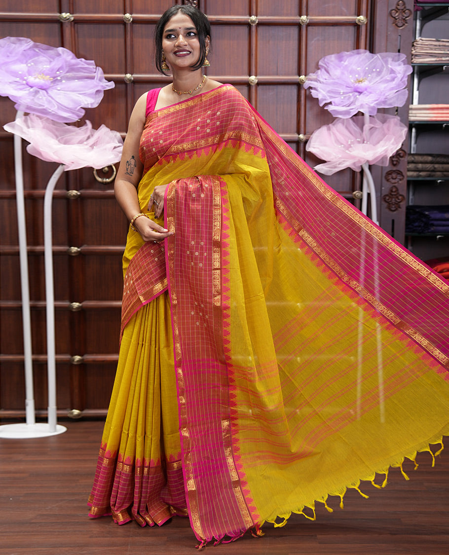Yellow Plain Chettinad Cotton Saree, Complemented by Contrast Traditional Temple Border of Butta Enclosed Checks, Subtly Striped Pallu, and Paired with a Matching Blouse